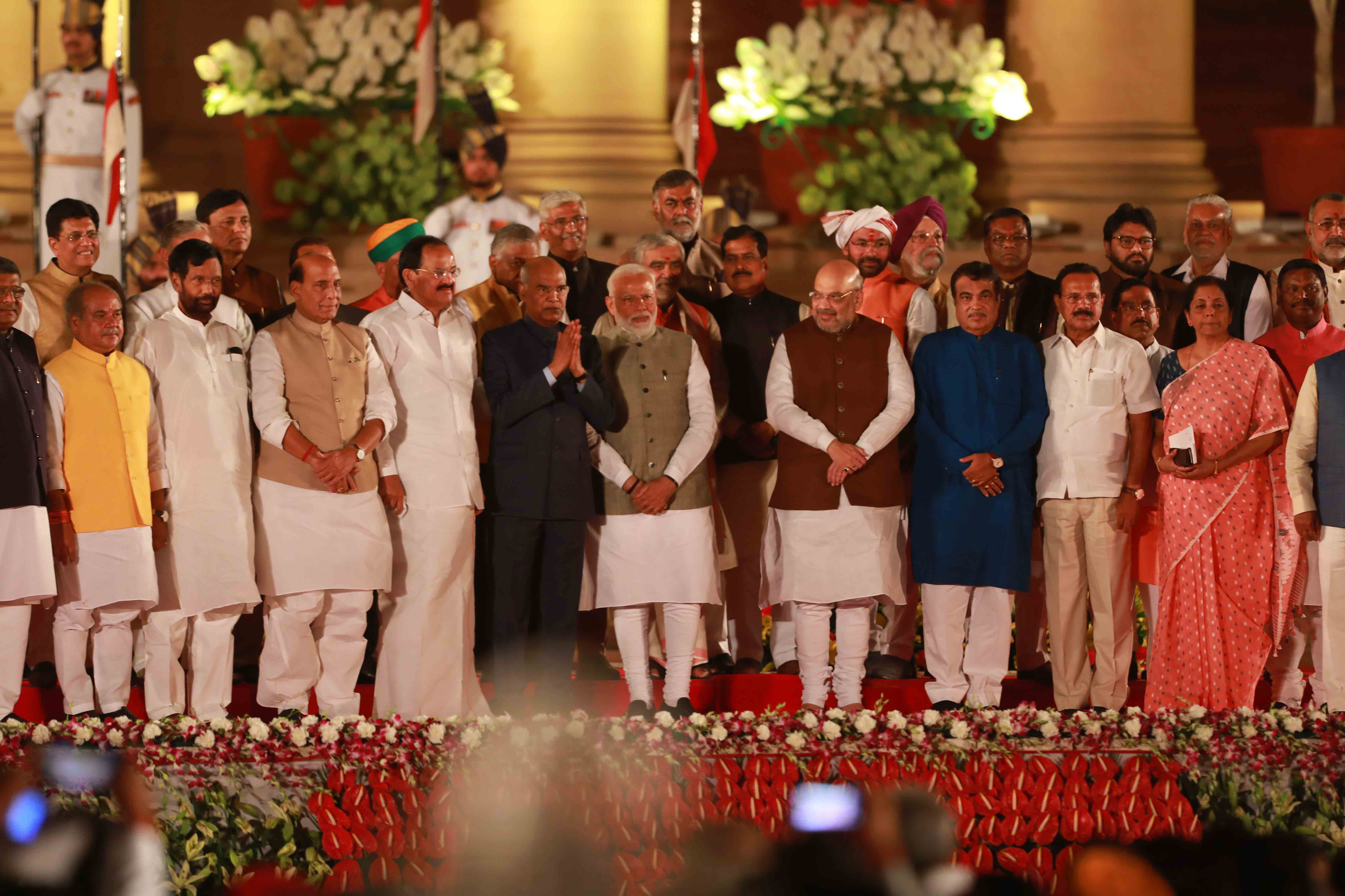President Ram Nath Kovind pose for a phorograph with Prime Minister Narendra Modi and his council of ministers during the swearing in ceremony at Rashtrapati Bhavan, in New Delhi on Thursday. UNI PHOTO-AK13U