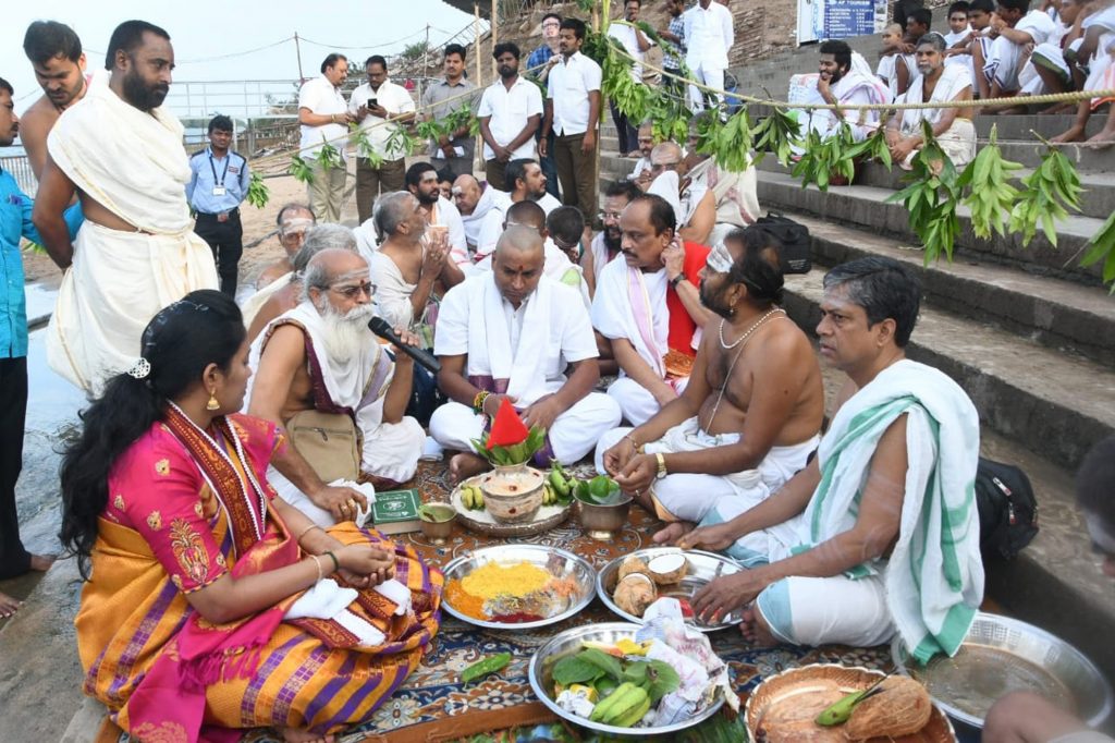 Minister for Endowment V Srinivas Rao and Executive officer of Durga temple Koteswaramma participating five-day Varuna Yajnam for rain as is no sign of monsoon rains in the state, at Durga Malleswara Devastanam of Kanaka Durga temple at Durga Ghat on the bank of the river Krishna in Vijayawada on Thursday.