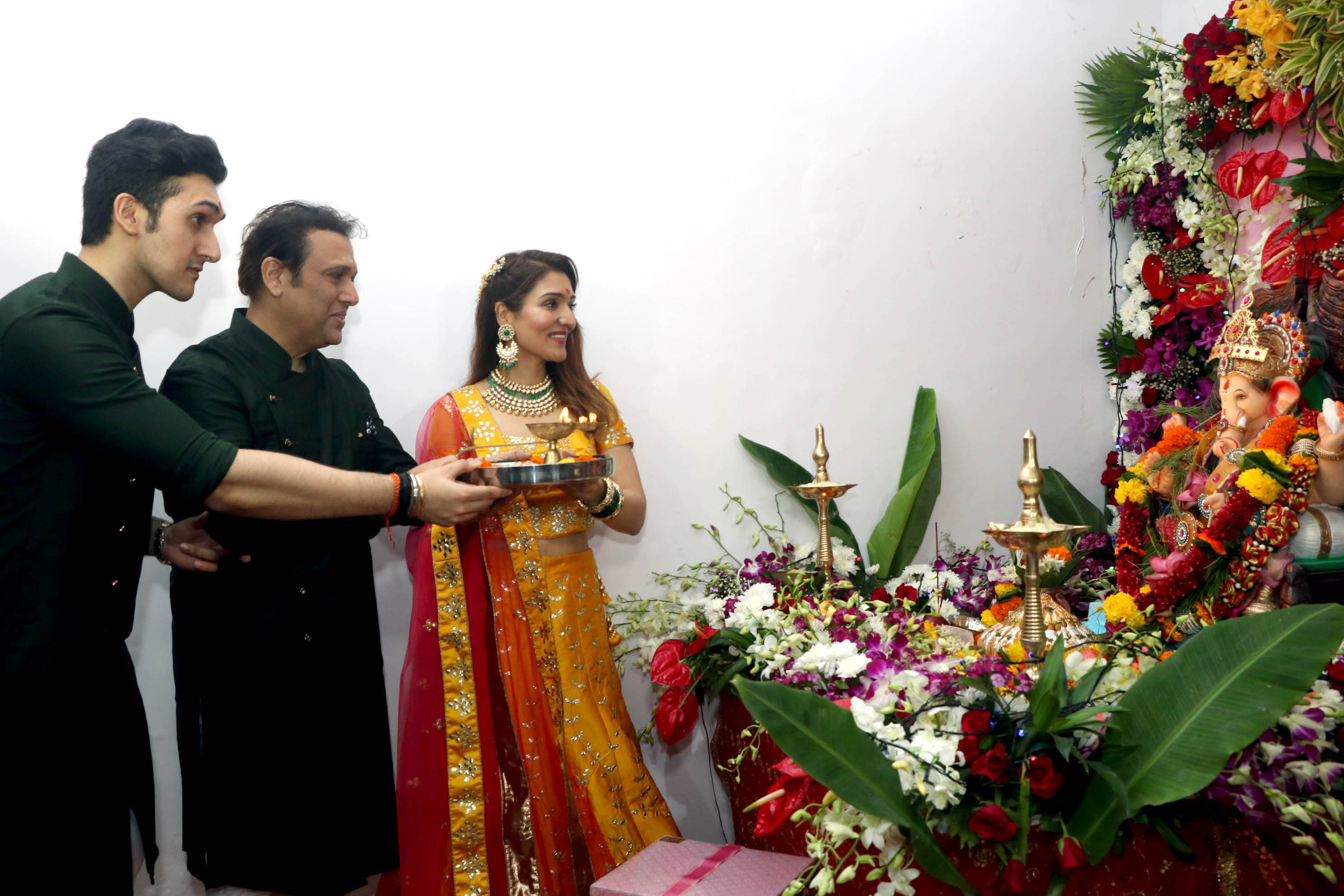 Bollywood actor Govinda celebrate Ganesh Chaturthi with daughter Tina Ahuja and son Yashvardhan at their Juhu Bungalow , in Mumbai on Monday.