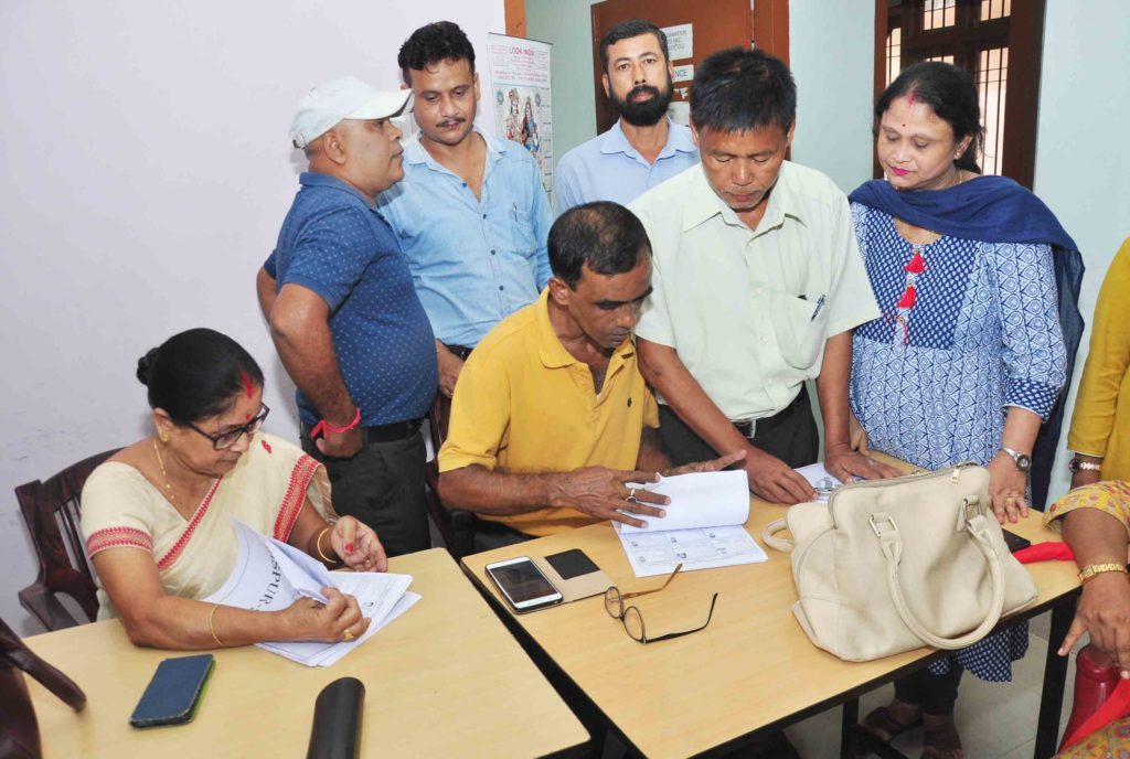 People search their names in NRC list at the NRC Seva Kendra in Guwahati on Saturday.