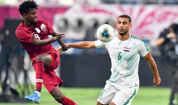 DOHA, Nov. 27, 2019 (Xinhua) -- Ali Adnan Kadhim (R) of Iraq vies with Yusuf Abdurisag of Qatar during the 24th Arabian Gulf Cup 2019 at the Khalifa International Stadium in Doha, capital of Qatar, Nov. 26, 2019. Xinhua/UNI PHOTO-2F