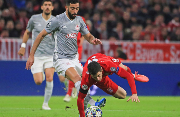 MUNICH, Nov. 7, 2019 (Xinhua) -- Robert Lewandowski (bottom) of Bayern Munich vies with Yassine Meriah (top) of Olympiacos during a UEFA Champions League group B match between FC Bayern Munich of Germany and Olympiacos Piraeus of Greece in Munich, Germany, on Nov. 6, 2019. (Photo by Philippe Ruiz/Xinhua/UNI PHOTO-4F