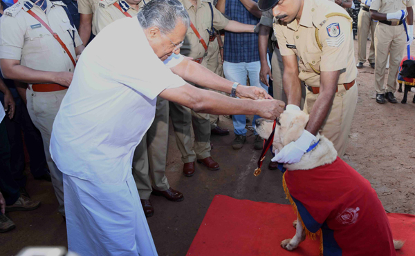 THIRUVANANTHAPURAM, NOV 1 (UNI)- Kerala Chief Minister Pinarayi Vijayan honouring a police dog during foundation day celebration of Kerala in Thiruvananthapuram on Friday.UNI PHOTO-49u