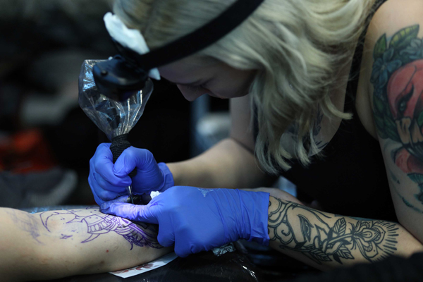 RIJEKA (CROATIA), Nov. 23 (Xinhua) -- A tattoo artist works on a design during the 9th Rijeka Tatto Expo in Rijeka, Croatia, on Nov. 22, 2019. The 9th Rijeka Tatto Expo kicked off on Friday in Rijeka of Croatia and will last until Nov. 24. (Nel Pavletic/Pixsell via Xinhua/UNI PHOTO-4F