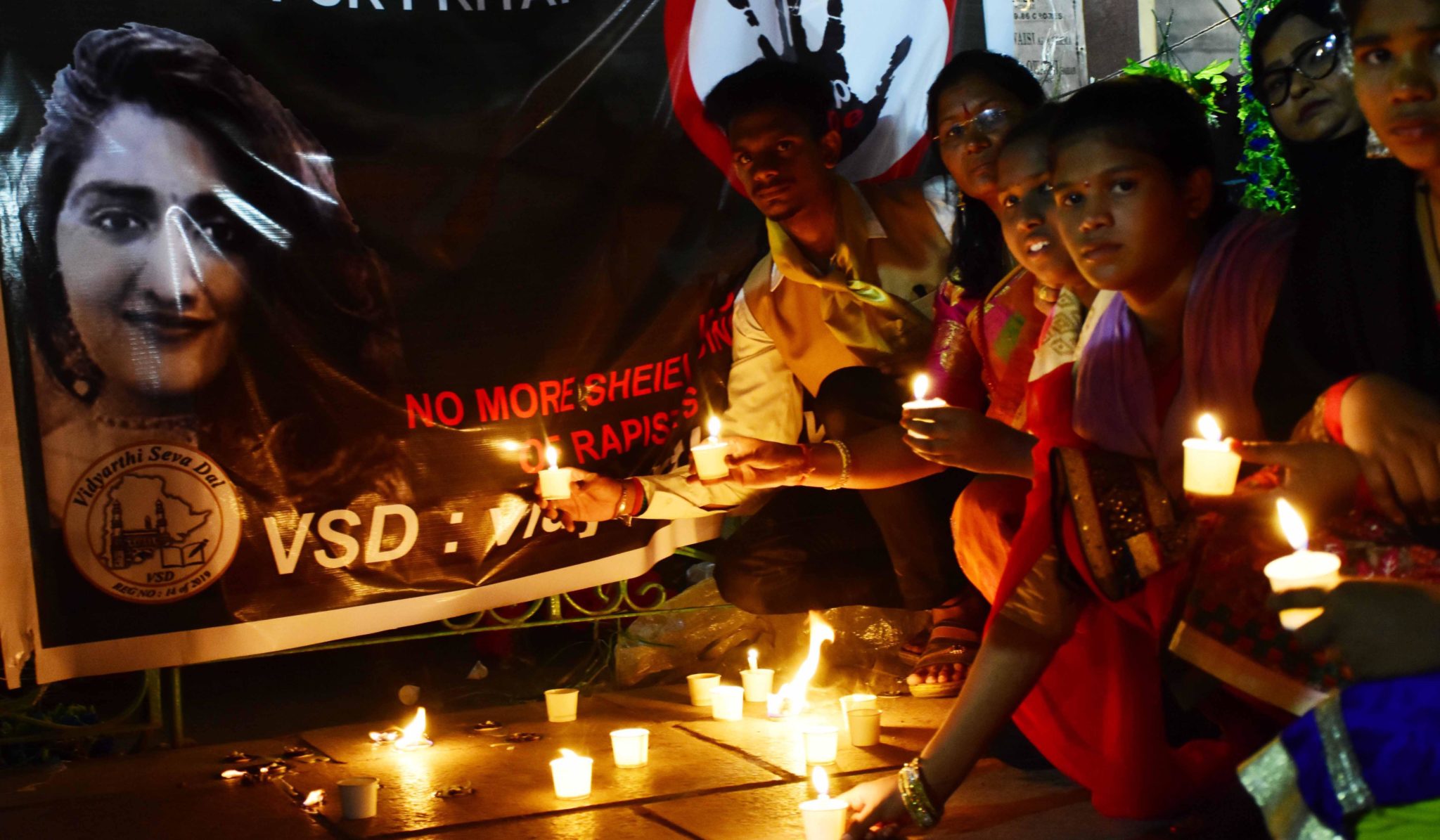HYDERABAD, NOV 30 (UNI) : VSD Students & women Paying Tributes In Front of Candle Light In Front of ( Vidyarthi Seva Dal ) Organized Candle Light Program, for Justice Brutal Rape and Murder of Veterinary Dr Priyanka Reddy, in Hyderabad on Saturday. UNI PHOTO RAO19U