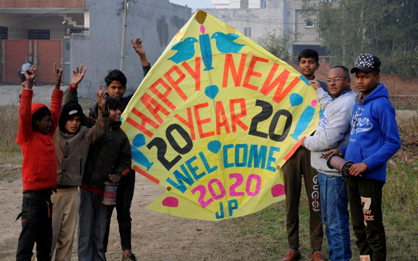 Amritsar: A kite-maker shows new year-themed kites to bid adieu to the outgoing year 2019 and to welcome the upcoming year 2020, at his workshop in Amritsar on Dec 31, 2019. (Photo: IANS)