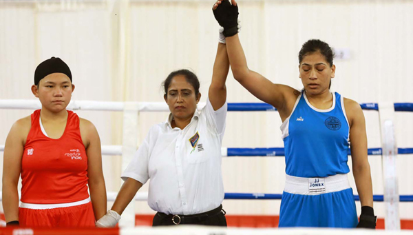 KANNUR, DEC 3 (UNI):- Referee lifting the hand of Aradhana Patel of Uttar Pradesh as she beat Indu Rani of Rajasthan in the 60-64 category preliminary round of the fourth Elite Women's National Boxing Championship-2019, in Kannur on Tuesday.UNI PHOTO-55U