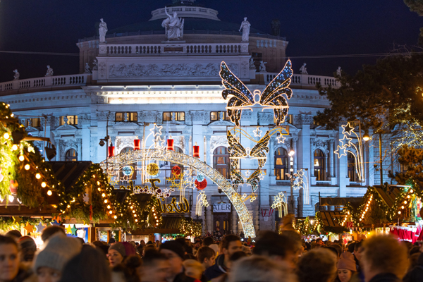 (191215) -- VIENNA, Dec. 15, 2019 (Xinhua) -- Photo taken on Dec. 15, 2019 shows the holiday illumination at the Christmas market on the Rathausplatz in Vienna, Austria. As one of the oldest and most famous Christmas markets in Europe, the Christmas market at Rathausplatz in Vienna attracts a large number of local residents and tourists every year during the holiday season. (Xinhua/Guo Chen)