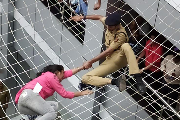 Mumbai: The woman who tried to commit suicide by jumping from the fourth floor of Mantralaya, being rescued after her fatal fall was prevented by the protective wire net, in Mumbai on Dec 13, 2019. (Photo: IANS)