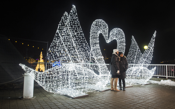 (191223) -- TORONTO, Dec. 23, 2019 (Xinhua) -- Two ladies pose for photos at a light display during the 2019 Aurora Winter Festival at Ontario Place in Toronto, Canada, Dec. 22, 2019. (Photo by Zou Zheng/Xinhua)