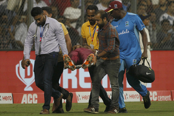 Mumbai: Evin Lewis of West Indies being taken for medical examination and treatment after he got injured during the third T20I match between India and West Indies at Wankhede Stadium in Mumbai on Dec 11, 2019. (Photo: Surjeet Yadav/IANS)