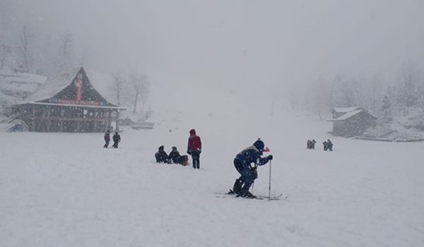 Manali: The Solang ski slopes near Manali wrapped in a thick blanket of snow, bringing cheers on the faces of skiers after the picturesque tourist spot in Himachal Pradesh experienced this season's first snowfall, on Dec 12, 2019. (Photo: IANS)