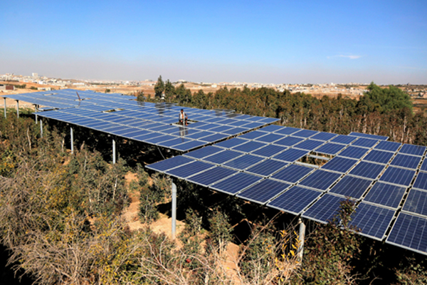 (191210) -- SANAA, Dec. 10, 2019 (Xinhua) -- A man checks solar panels installed to power his water pump in Sanaa, Yemen, Dec. 8, 2019. Amid nearly five years of grinding war and electricity cut in Yemen, many Yemenis turn to solar power to keep lights on. (Photo by Mohammed Mohammed/Xinhua)