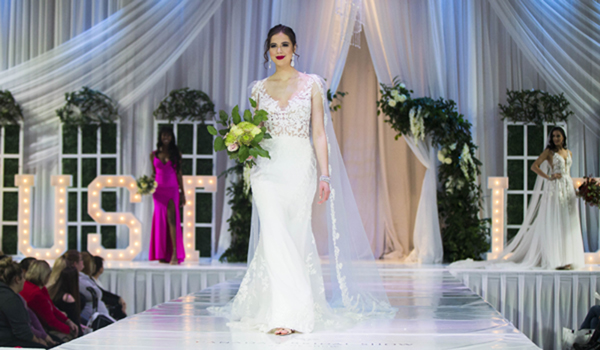 (200112) -- TORONTO, Jan. 12, 2020 (Xinhua) -- A model (Front) presents a wedding dress during the 2020 Canada's Bridal Show in Toronto, Canada, Jan. 11, 2020. The three-day bridal show was held here from Friday to Sunday. (Photo by Zou Zheng/Xinhua)