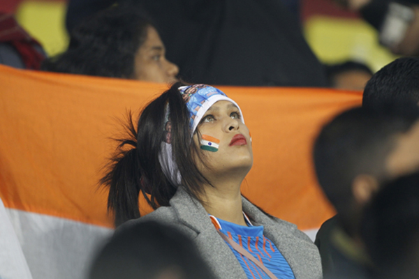 Guwahati: A fan looks towards the sky as rains delays the start of 1st T20I match between India and Sri Lanka at Barsapara Cricket Stadium in Guwahati on Jan 5, 2020. (Photo: IANS)