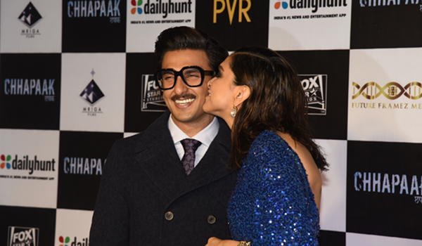 Mumbai: Actress Deepika Padukone kisses her actor husband Ranveer Singh at the screening of her film "Chhapaak" in Mumbai on Jan 8, 2020. (Photo: IANS)