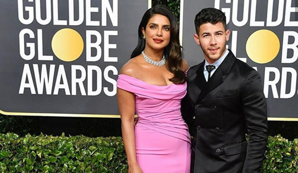 Priyanka Chopra Jonas and her hubby Nick Jonas made a stylish appearance at the red carpet of the 77th Golden Globe Awards ceremony.Dressed in a pink off-shoulder ensemble, Priyanka looked no less than any diva and it was her diamond neckpiece which grabbed the maximum attention. On the other hand, Nick look dapper in a black suit.