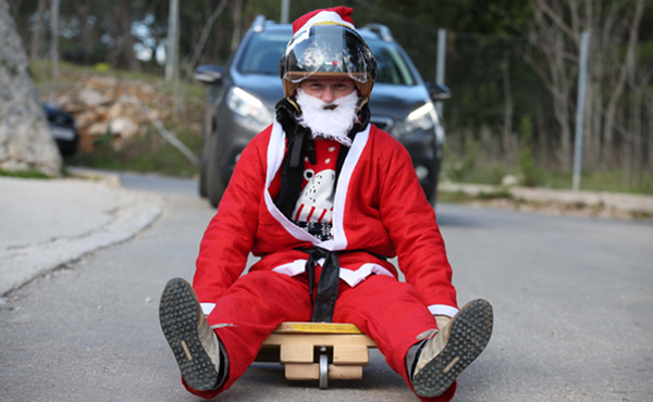 SIBENIK, Dec. 29, 2019 (Xinhua) -- A man dressed in Santa Clause costume steers his home-made cart in a toy vehicle race in Sibenik, Croatia, on Dec. 28, 2019. (Dusko Jaramaz/Pixsell via Xinhua/IANS)