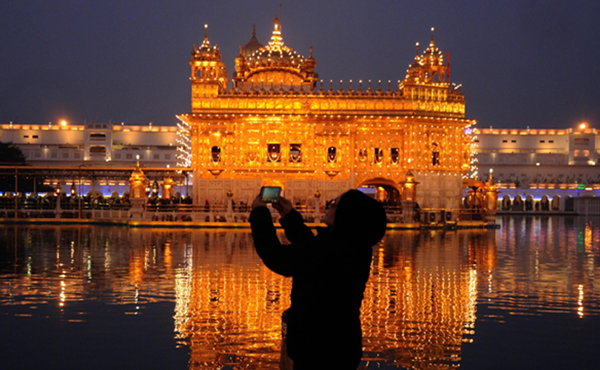 Amritsar: Devotees at the illuminated Golden Temple during Guru Gobind Singh Jayanti celebrations in Amritsar on Jan 2, 2020. (Photo: IANS)