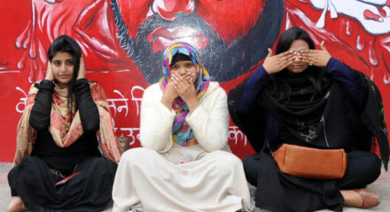 New Delhi: Protesters sit in the pose of Mahatma Gandhi's three wise monkeys during a demonstration against the Citizenship Amendment Act (CAA) 2019, National Register of Citizens (NRC) and National Population Register (NPR), at Jamia Nagar in New Delhi on Jan 31, 2020. (Photo: IANS)