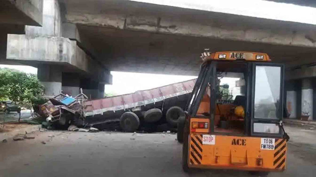 Hyderabad: A cement laden truck skidded off Shamirpet flyover in Hyderabad injuring two, on May 30, 2020. (Photo: IANS)