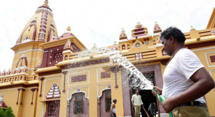 Bhopal: A temple staff washes the Birla temple as it gears up to re-open from June 8; in Bhopal on Jun 6, 2020. (Photo: IANS)