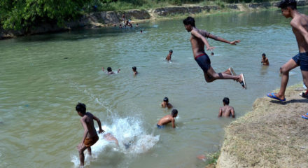 Amritsar: Boys cool themselves in a canal on a hot sunny day, on the outskirts of Amritsar on June 15, 2020. (Photo: IANS)