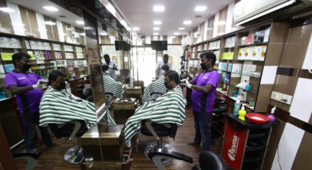 Chennai: Hairdressers busy giving hair cut to the customers after salons across Chennai reopened on the first day of the fifth phase of the nationwide lockdown imposed to mitigate the spread of coronavirus, on June 1, 2020. (Photo: IANS)