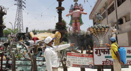 Amritsar: A municipal worker sprays disinfectant at Gufa Wala Mandir in Delhi's Preet Vihar as it gears up to reopen for devotees from tomorrow as part of Unlock 1.0 or phased relaxation during the fifth phase of the nationwide lockdown imposed to mitigate the spread of coronavirus, on June 7, 2020. (Photo: IANS)