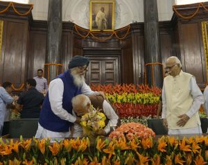 Prime Minister Narendra Modi takes blessing of Siromoni Akali Dal leader Prakash Singh Badal on being elected as leader of the NDA Parliamentary party,in New Delhi on Saturday. UNI P