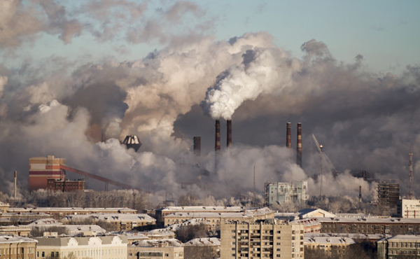 Poor environment in the city. Environmental disaster. Harmful emissions into the environment. Smoke and smog. Pollution of the atmosphere by plants. Exhaust gases.