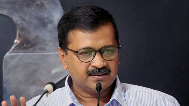 Kejriwal gives ownership certificates to slum families