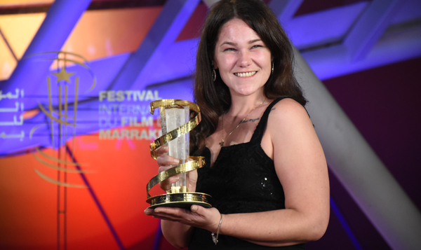 (191208) -- MARRAKECH, Dec. 8, 2019 (Xinhua) -- British actress Roxanne Scrimshaw poses with her trophy for the Best Actress award at the closing ceremony of the 18th Marrakech International Film Festival in Marrakech, Morocco, Dec. 7, 2019. (Photo by Chadi/Xinhua)