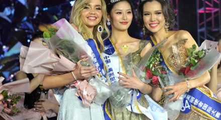 (191224) -- MANZHOULI, Dec. 24, 2019 (Xinhua) -- The first place winner Chinese contestant Zang Xipo (C), the second place winner Mongolian contestant CH_ANUUJIN (R), and the third place winner Russian contestant Golovina Alexandria of an international beauty contest pose for a group photo in Manzhouli, north China's Inner Mongolia Autonomous Region, Dec. 23, 2019. The final of the 16th China-Russia-Mongolia International Beauty Pageant was held here on Monday. (Xinhua/Xu Qin)
