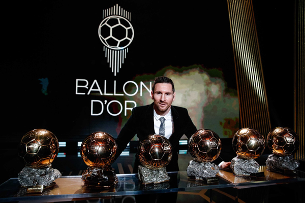PARIS, DEC. 3, 2019 (Xinhua) -- The Men's 2019 Ballon d'Or winner Barcelona forward Lionel Messi poses with his six Ballon d'Or trophies he won in his career so far during the ceremony at the Theatre du Chatelet in Paris, France, Dec. 2, 2019. Xinhua/UNI PHOTO-5F