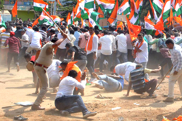 Kolar: Police baton-charges BJP and Pro Hindu activists after they gathered under the banner of Bharathiya Nagareekara Rakshana Vedikae during a rally to support the Citizenship Amendment Act (CAA) 2019 and attempted to take out a procession from SNR Circle to another circle without permission, in Karnataka's Kolar on Jan 4, 2020. (Photo: IANS)