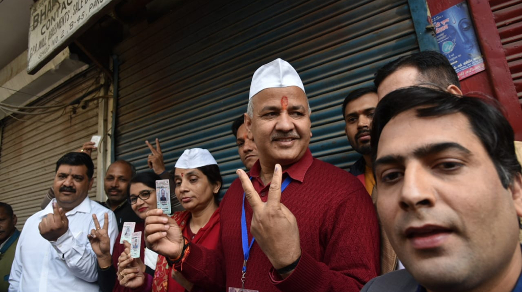 New Delhi: Delhi Deputy Chief Minister and AAP's candidate from Patparganj Manish Sisodia displays victory sign after casting his vote for the Delhi Assembly elections 2020, on Feb 8, 2020. (Photo: IANS)