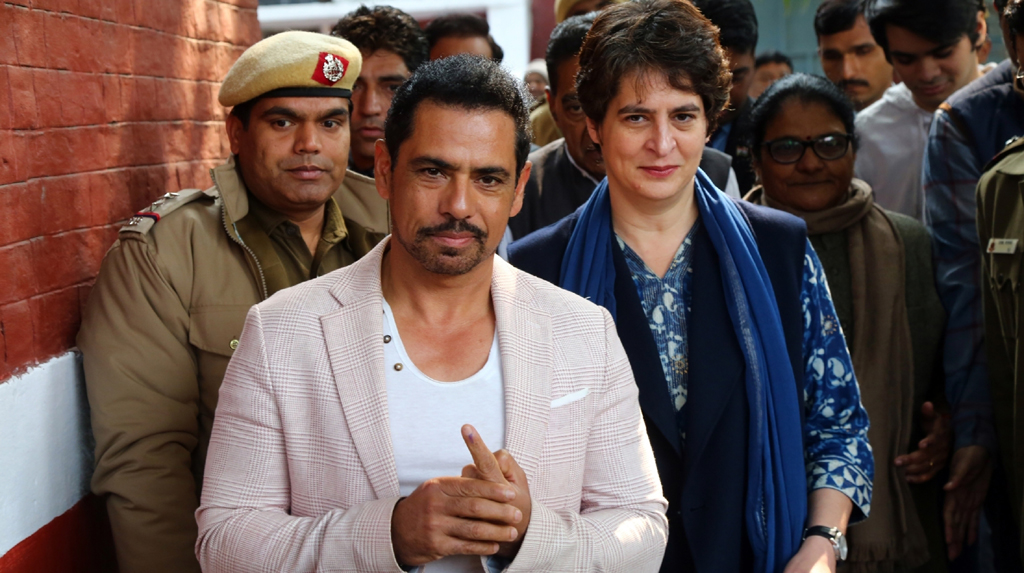 New Delhi: Congress General Secretary Priyanka Gandhi Vadra and her husband Robert Vadra leave after casting their votes for the Delhi Assembly elections 2020 at a polling booth in central Delhi's Nirman Bhawan on Feb 8, 2020. (Photo: IANS)