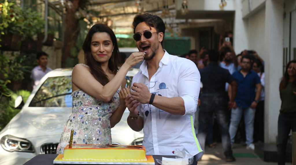 Mumbai: Actress Shraddha Kapoor accompanied by her "Baaghi 3" co-star Tiger Shroff, cuts her birthday cake during the promotions of their upcoming film in Mumbai on March 3, 2020. (Photo: IANS)