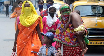Kolkata: Migrant returnees walk past a Kolkata street after arriving in the city during the fifth phase of the nationwide lockdown imposed to mitigate the spread of coronavirus, on June 5, 2020. (Photo: Kuntal Chakrabarty/IANS)