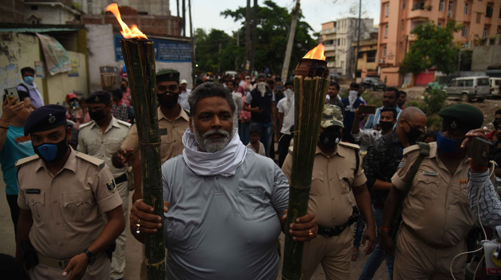 Patna: Jan Adhikar Party chief Pappu Yadav participates in a torch rally to protest against the Bihar Government over various issues, in Patna on June 12, 2020. (Photo: IANS)