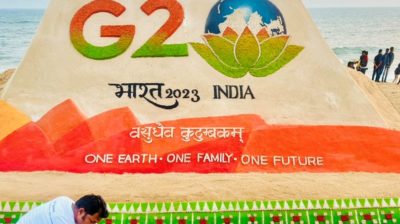 G20 logo on sand art