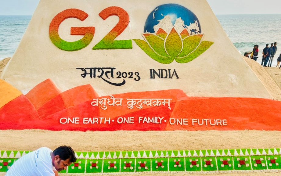 G20 logo on sand art